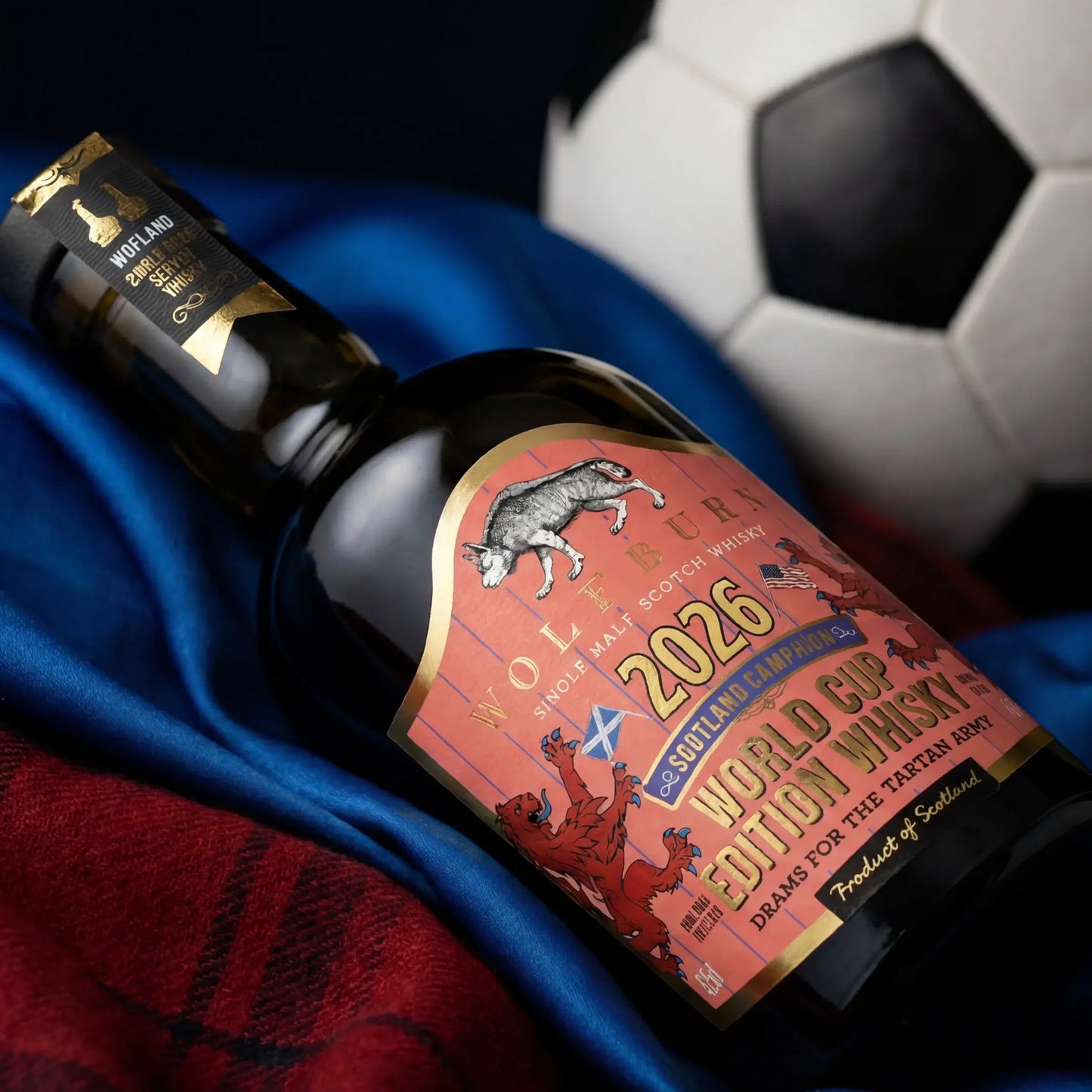 Morven World Cup Campaign Single Malt Scotch Whisky bottle resting on Scotland blue away shirt fabric with tartan and football in background