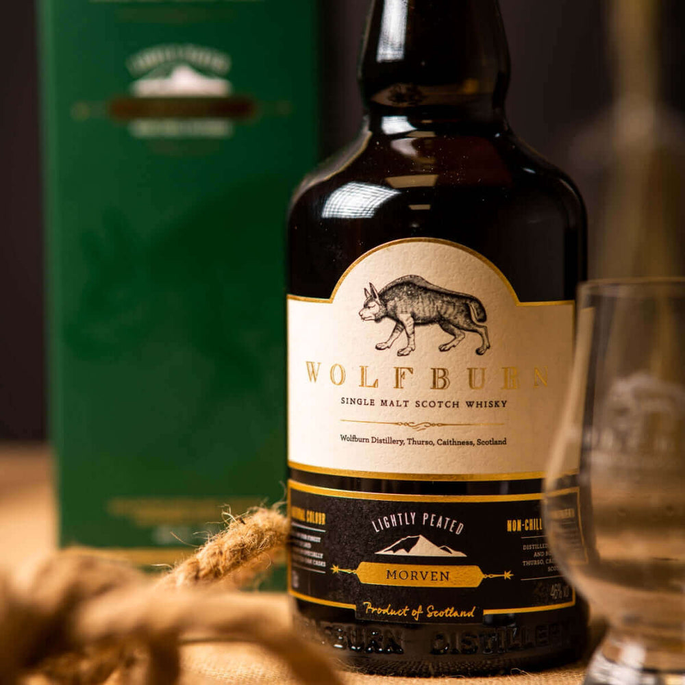
                  
                    Wolfburn Distillery Wolfburn Morven – 46% vol. 70cl This lightly peated whisky is made from malted barley infused with smoke during the drying process. It’s a reflection of history – the original 19th Century distillery was largely fired by peat. Gentle d
                  
                