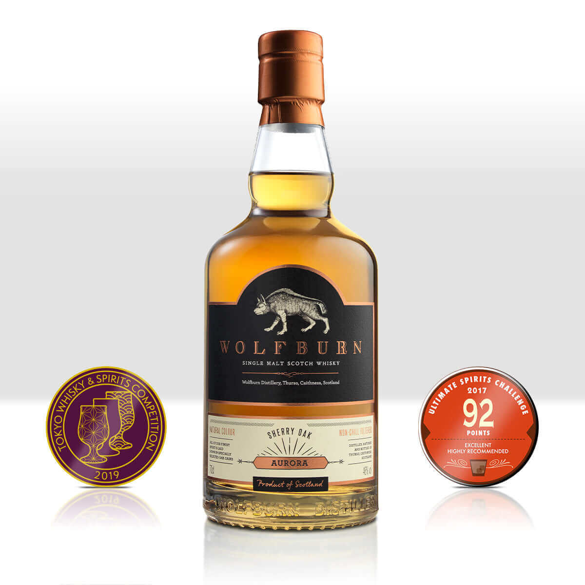 Wolfburn Aurora Single Malt Scotch Whisky bottle with awards, showcasing its exceptional quality and smooth flavor.