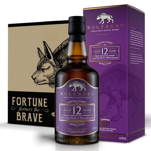 A bottle of Wolfburn 12-year-old single malt Scotch whisky stands beside a matching purple box. Both feature SeaWolf logo, conveying elegance.