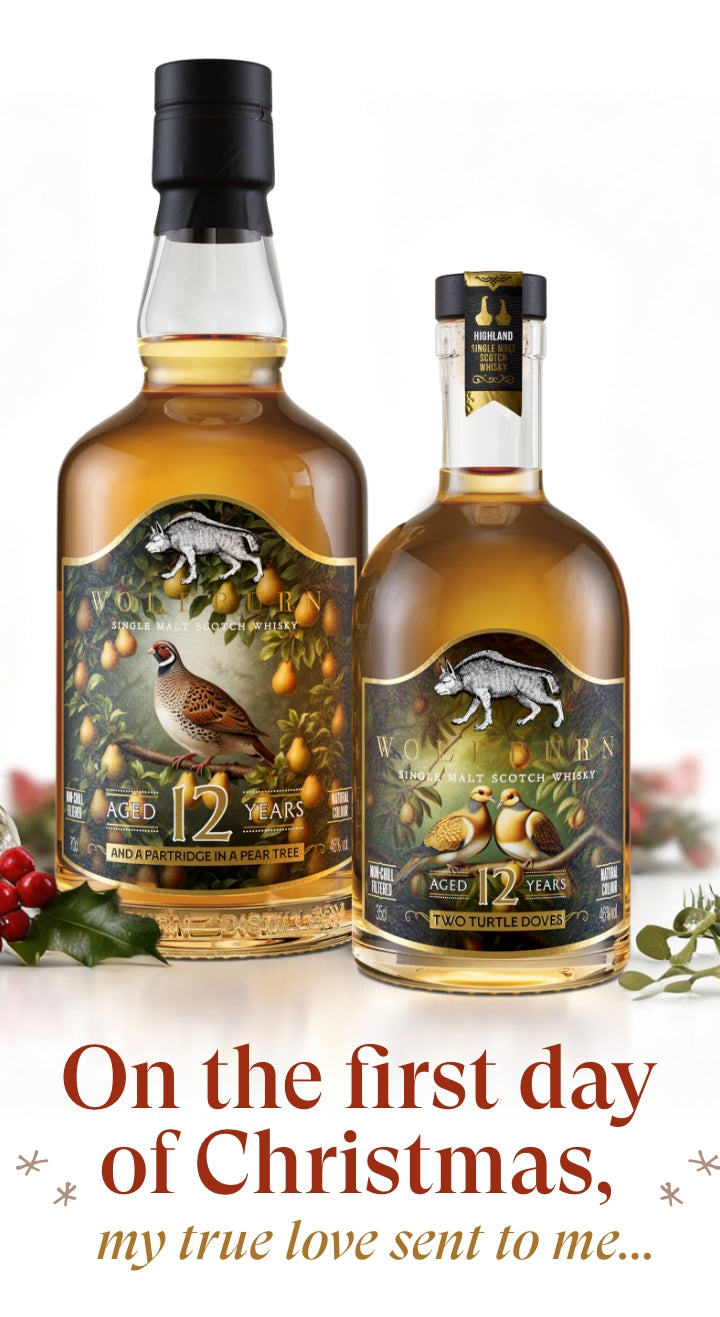 Two bottles of whisky with Christmas-themed text and decorations.