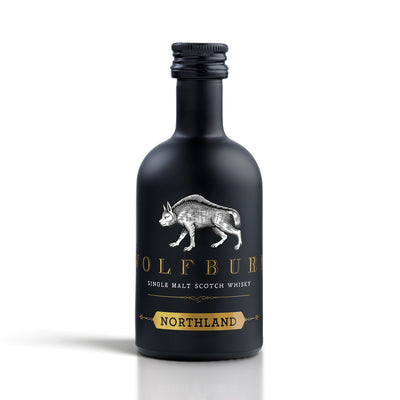 Black miniature bottle of Wolfburn Northland single malt Scotch whisky on a white background