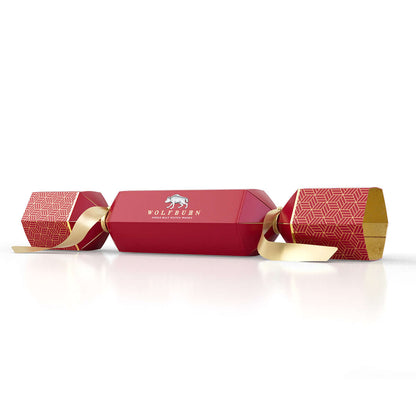 Red cracker with gold accents and Wolfburn logo on a white background