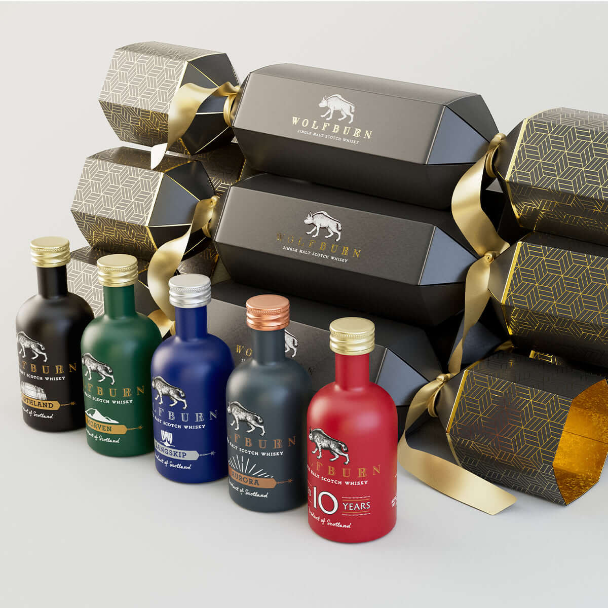 Wolfburn Luxury Christmas Crackers in a bundle of 6, each featuring a 5cl miniature Single Malt Scotch Whisky, festive hat, joke, and iconic Wolfburn pin badge