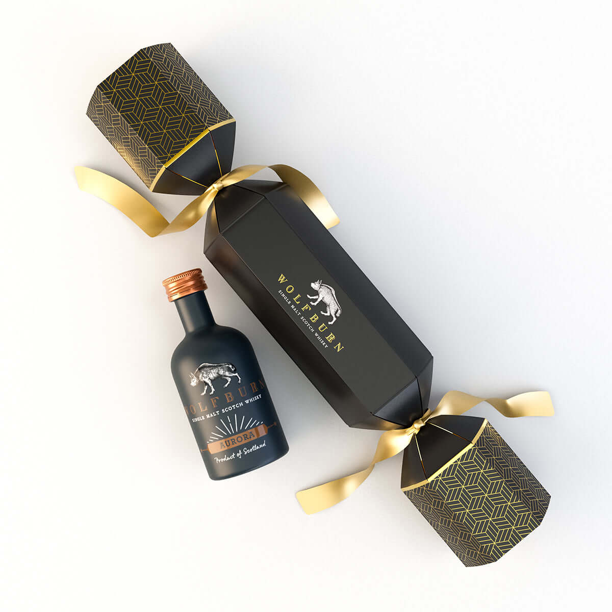 Wolfburn Luxury Christmas Cracker featuring a 5cl miniature Single Malt Scotch Whisky, festive hat, joke, and iconic Wolfburn pin badge