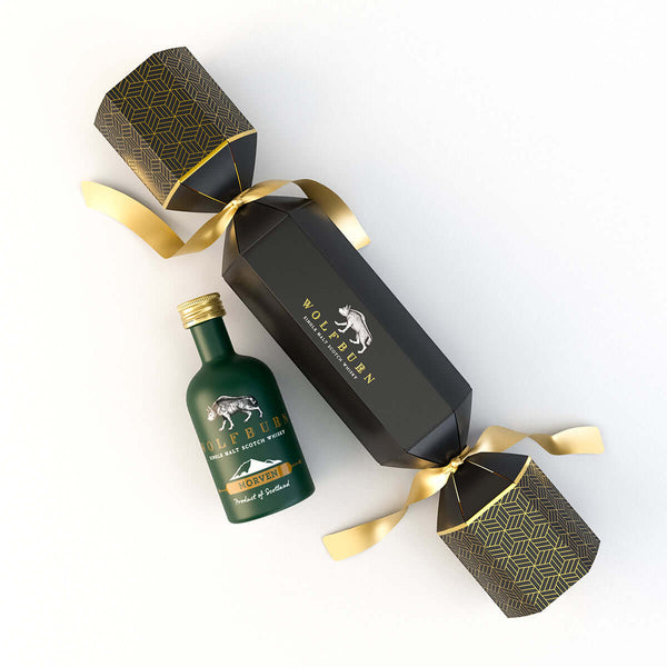 Wolfburn Morven Luxury Whisky Christmas Cracker featuring a 5cl miniature Single Malt Scotch Whisky, festive hat, joke, and iconic Wolfburn pin badge