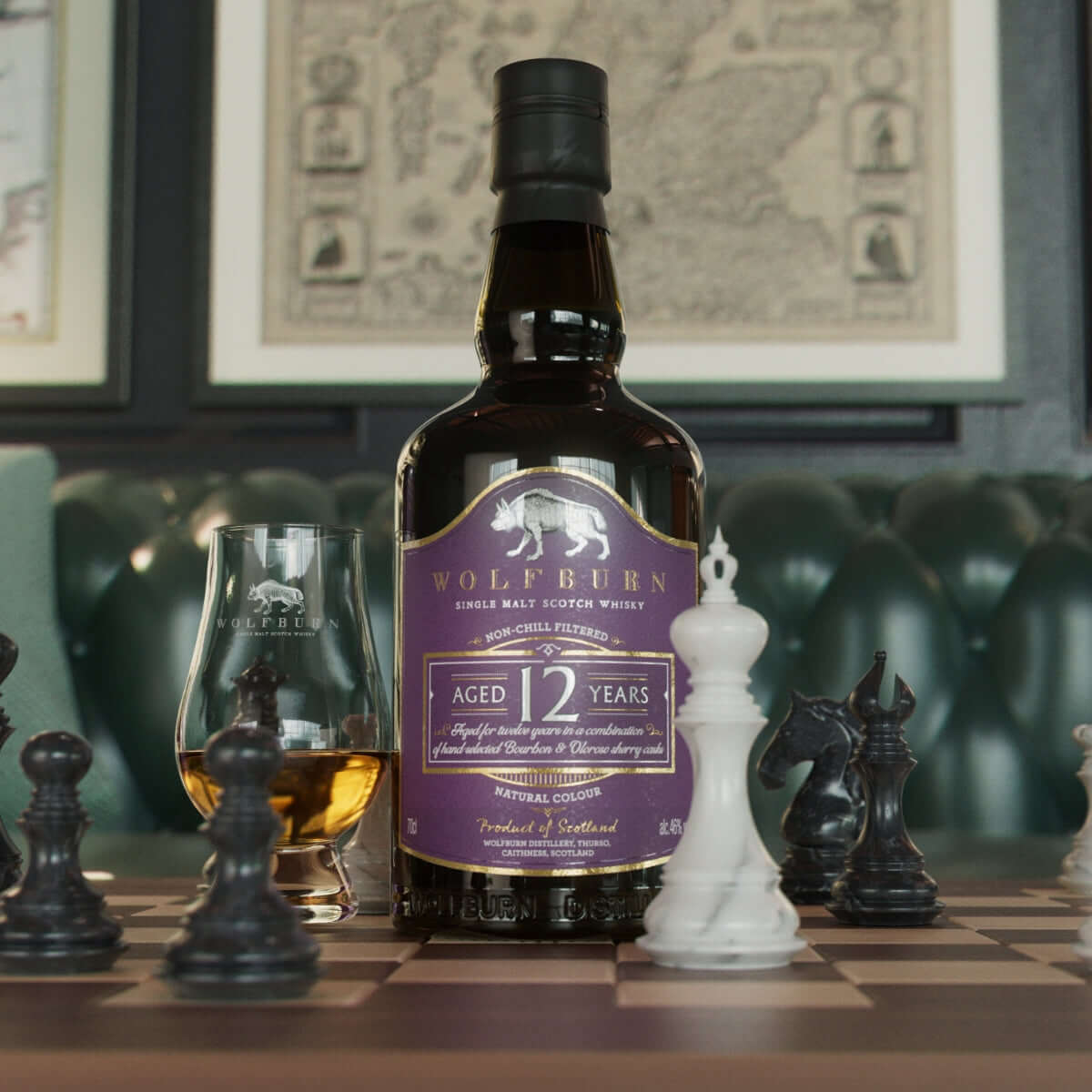 A bottle of Wolfburn 12-year Scotch whisky is placed on a chessboard among pieces, with a filled glass beside it. The setting is elegant and sophisticated.