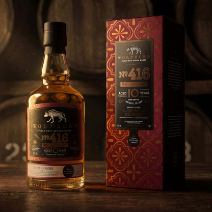 Small Batch 416 Single Malt Scotch Whisky bottle and packaging, aged 10 years, displayed against wooden casks.