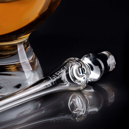 Close-up of Glencairn Pipette Whisky Water Dropper showing etched Glencairn branding beside a glass of whisky
