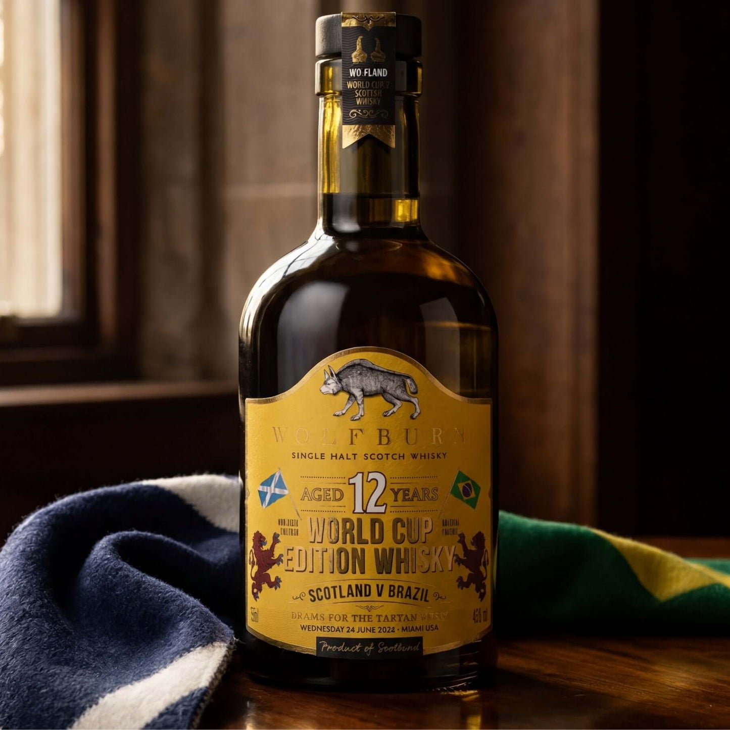 Bottle of 12-year-old World Cup Edition Single Malt Scotch Whisky on a wooden surface with a Scotland and Brazil scarf