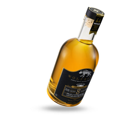 Angled Bottle of Wolfburn Single Malt Scotch Whisky on a white background