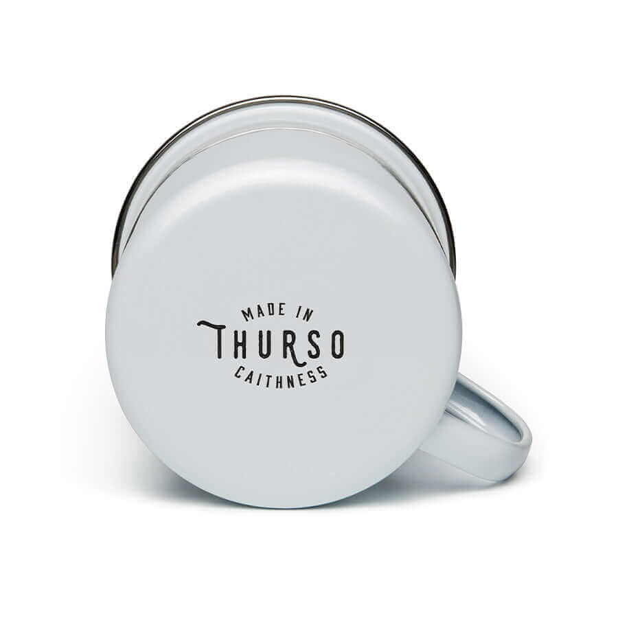 Wolfburn Enamel Mug - White Our Wolfburn branded ‘Fortune Favours the Brave’ 11oz Enamel Mug is hand-enamelled to add to its unique charm. The Mug body is made using durable carbon steel which is enamel glazed, and complete with a 304 food-grade stainless